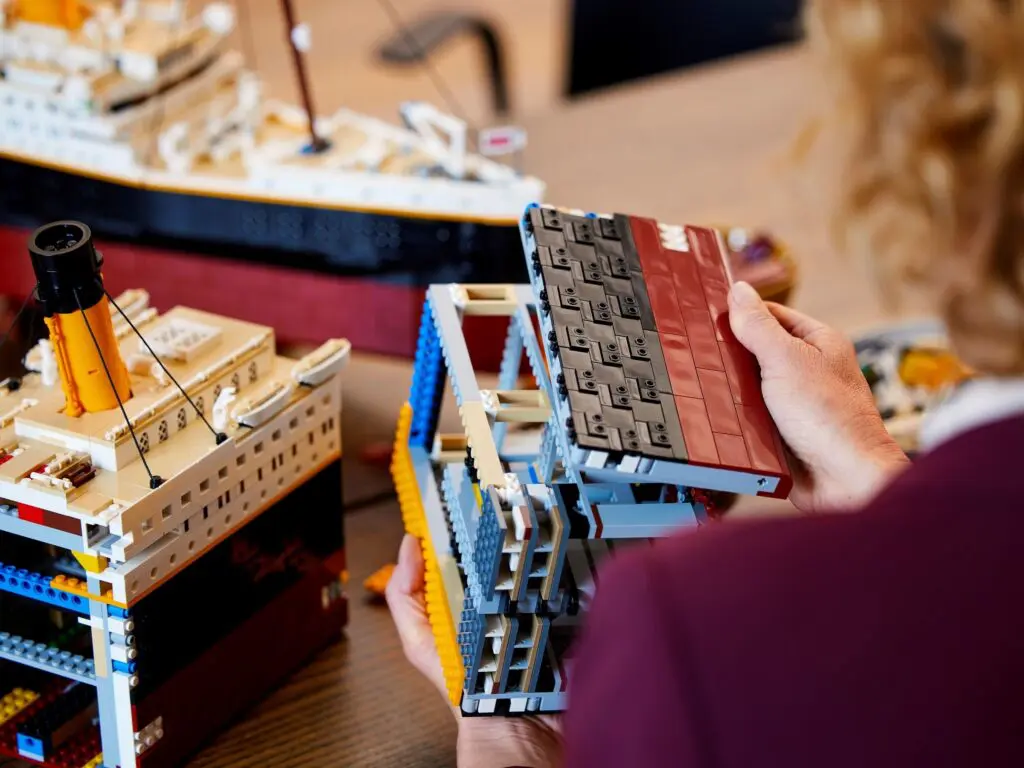 Hands holding ship model section