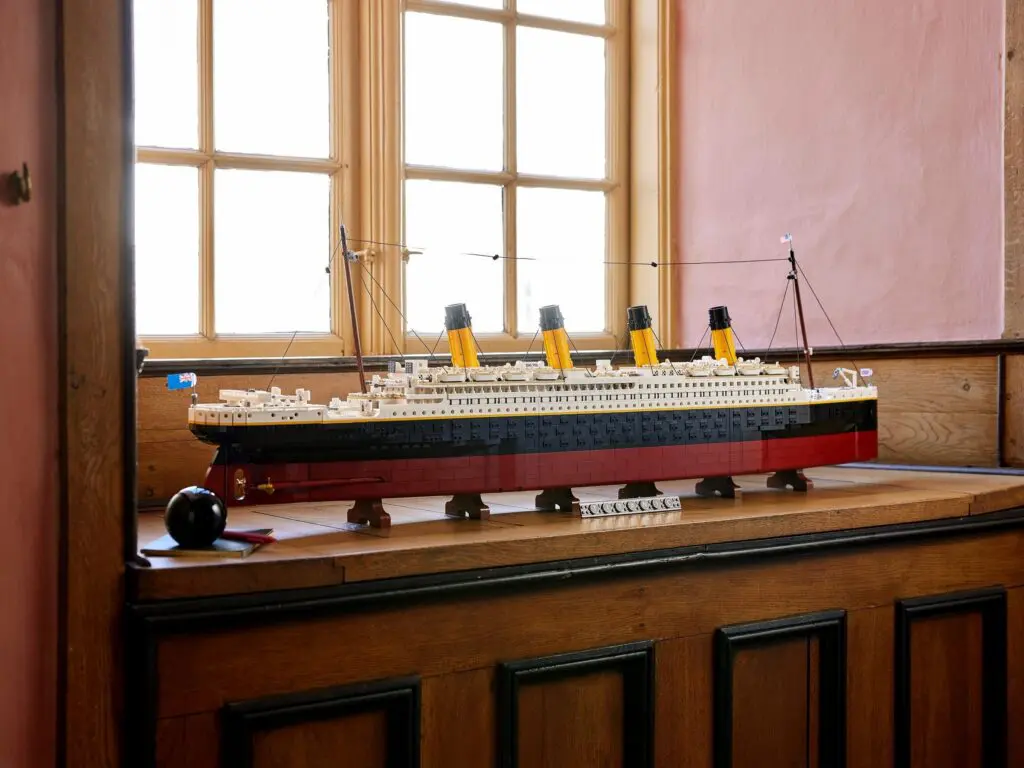 Model ship with yellow funnels indoors