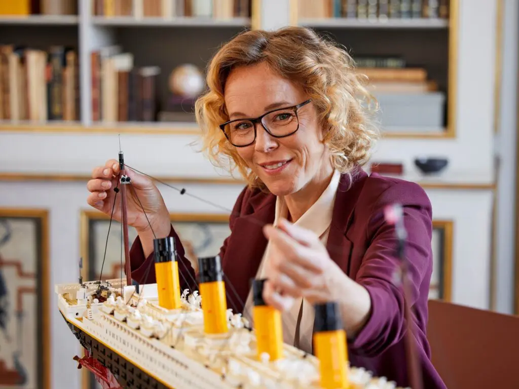 Woman assembling a model ship