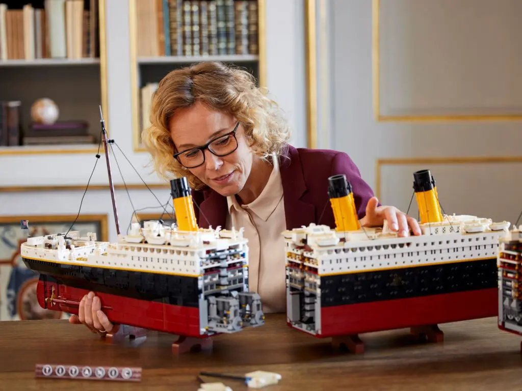 Person assembling Titanic model ships
