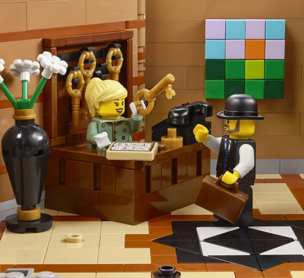 Lego figures at reception desk