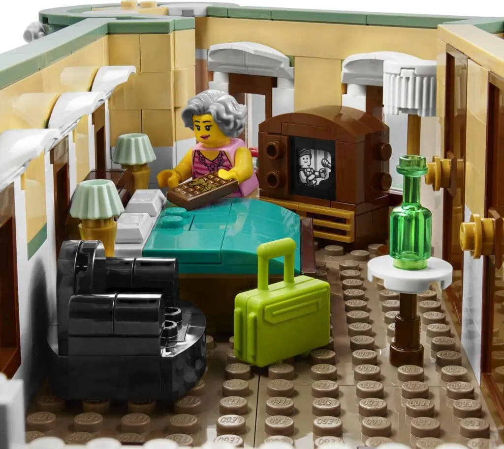 Minifigure holding a box in bedroom