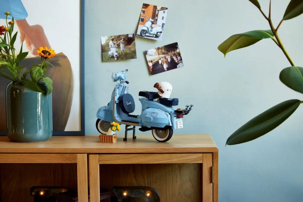 Miniature scooter with plants and photos