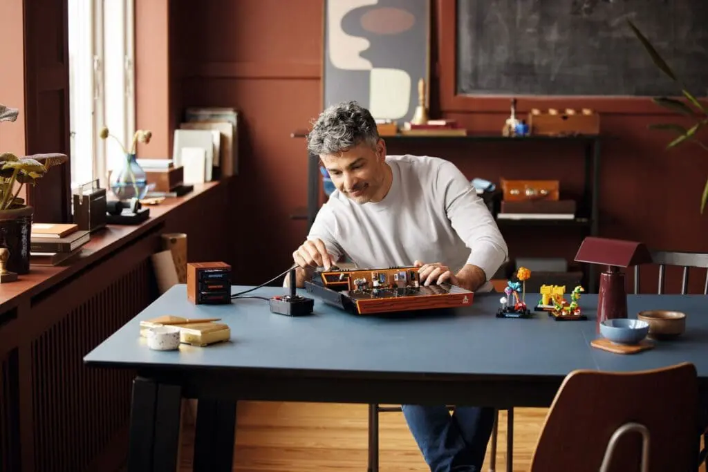 Hobbyist assembling ship model indoors
