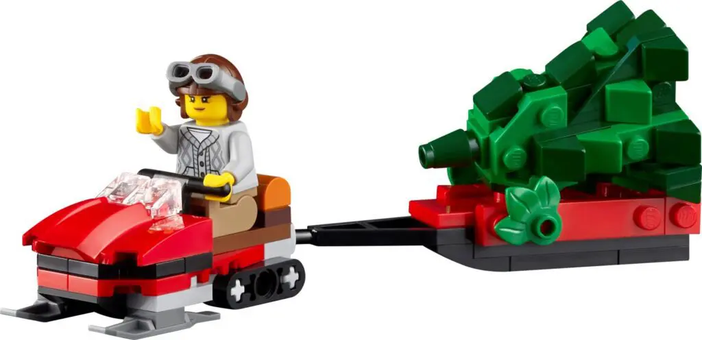 Miniature LEGO snowmobile pulling tree