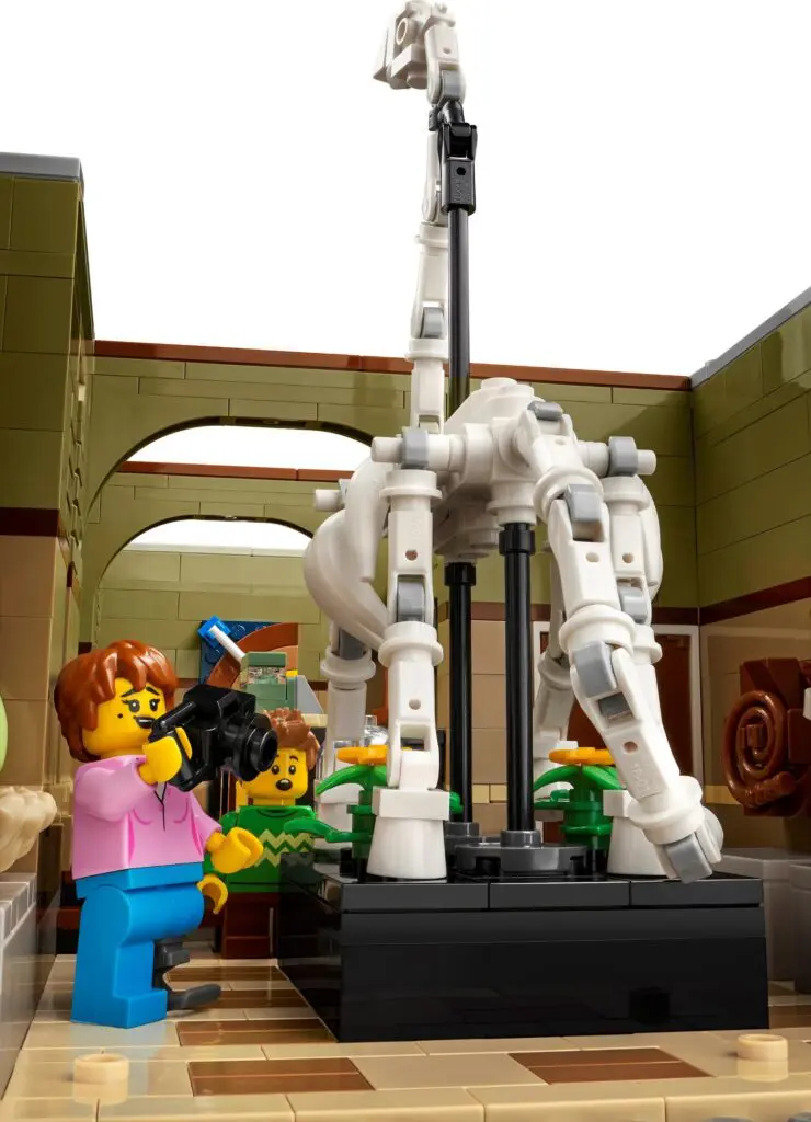 Toy figures exploring a dinosaur display