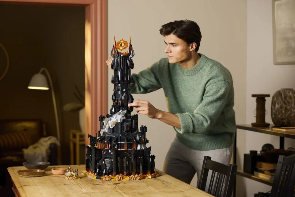 Individual constructing elaborate miniature tower