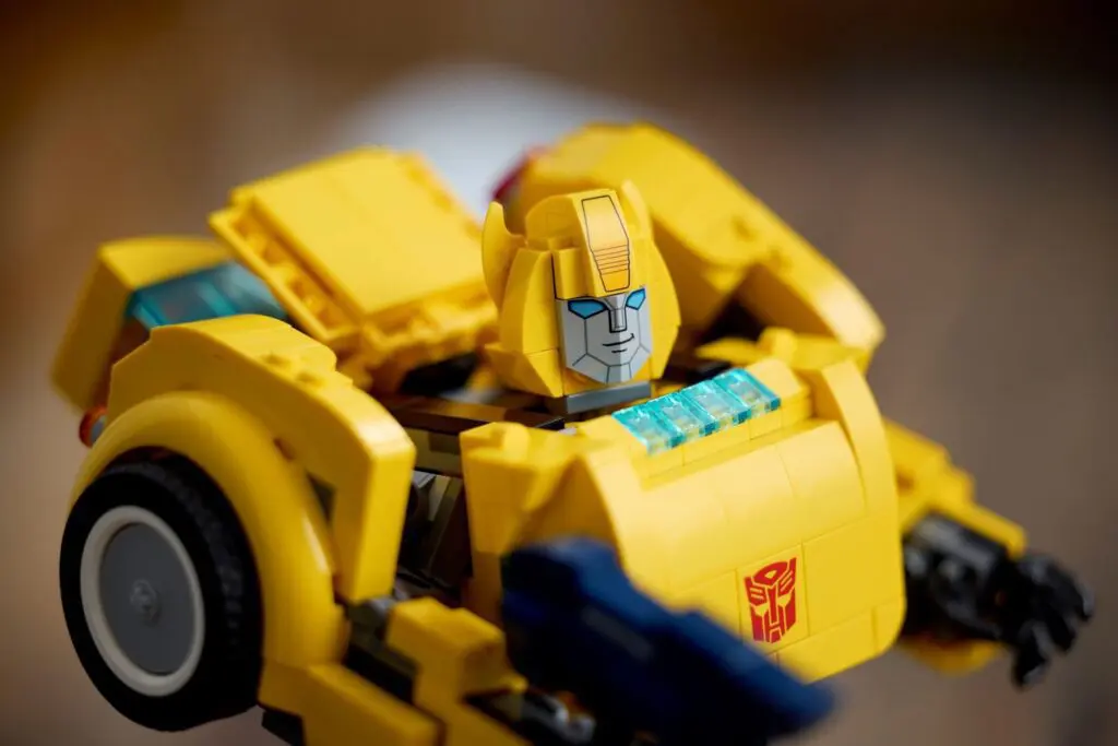 Yellow robot toy with blue eyes