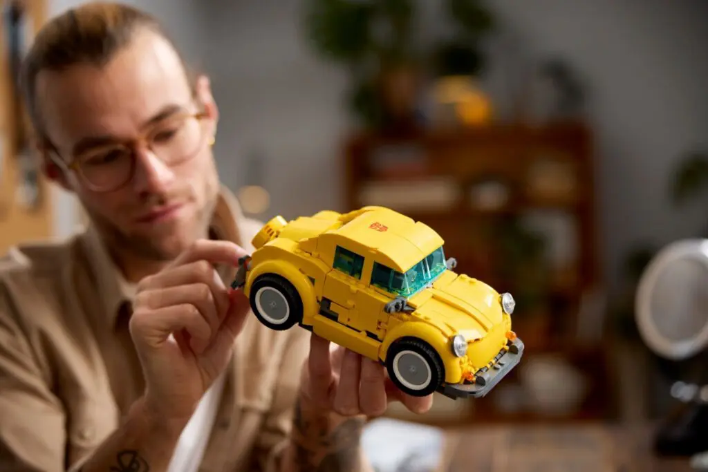 Man examining detailed toy vehicle
