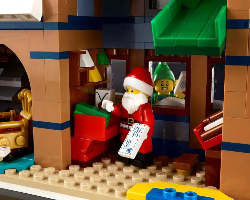 Santa and elf in toy workshop