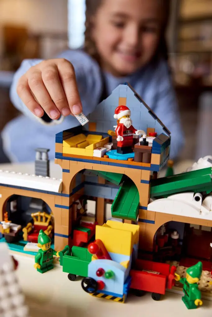 Child playing with festive building blocks