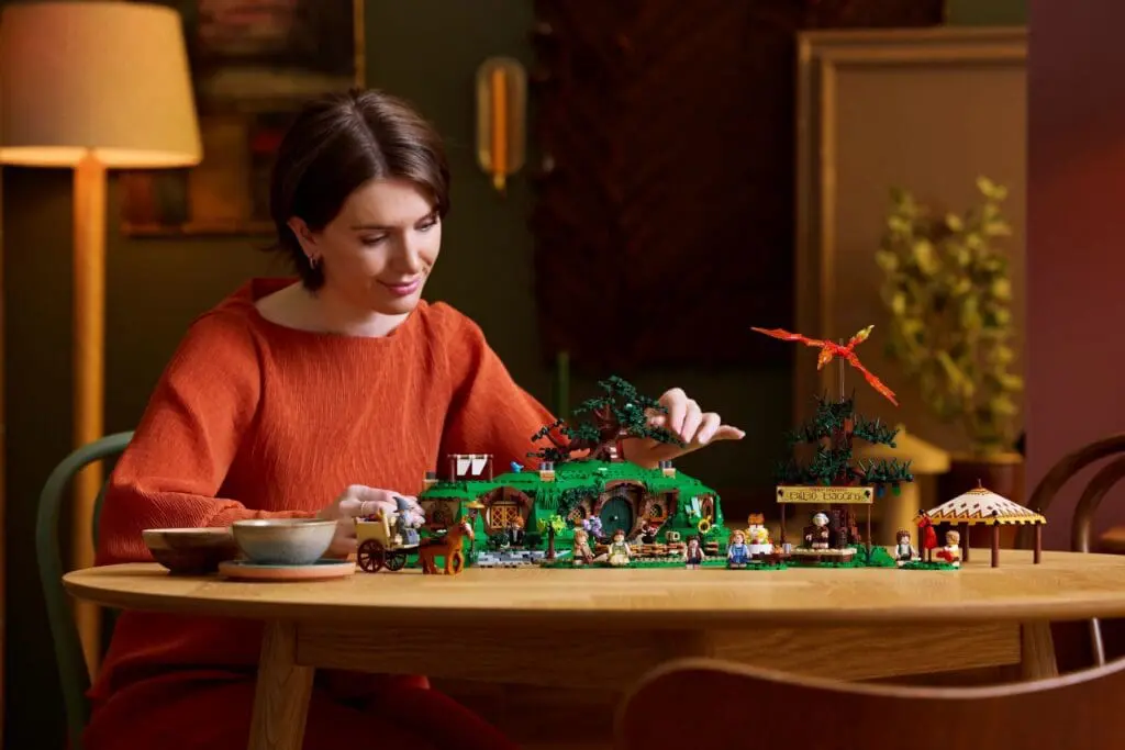 Enthusiast constructing intricate Lego scene