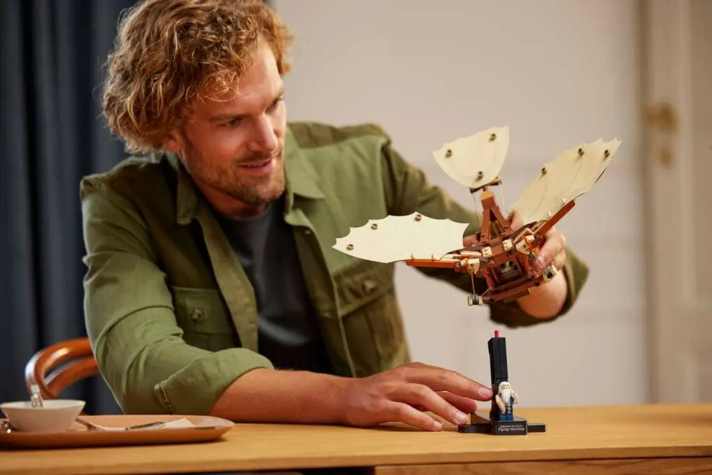 Person building mechanical winged device