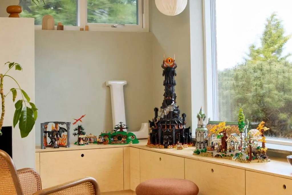 LEGO sets displayed on wooden cabinet
