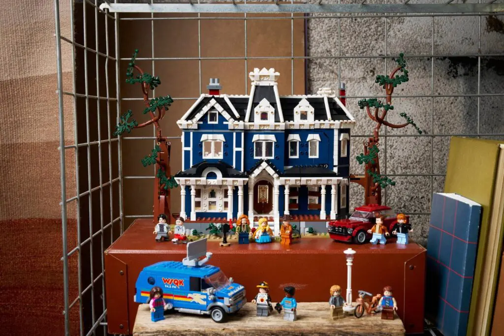 Lego house with minifigures and vehicles
