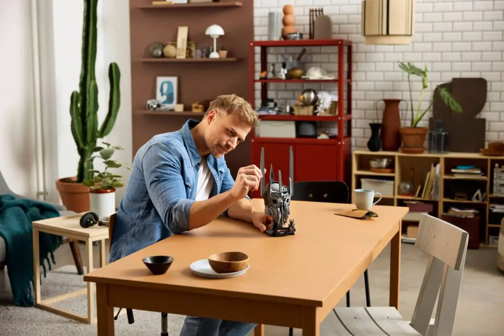 Man building a model in cozy room