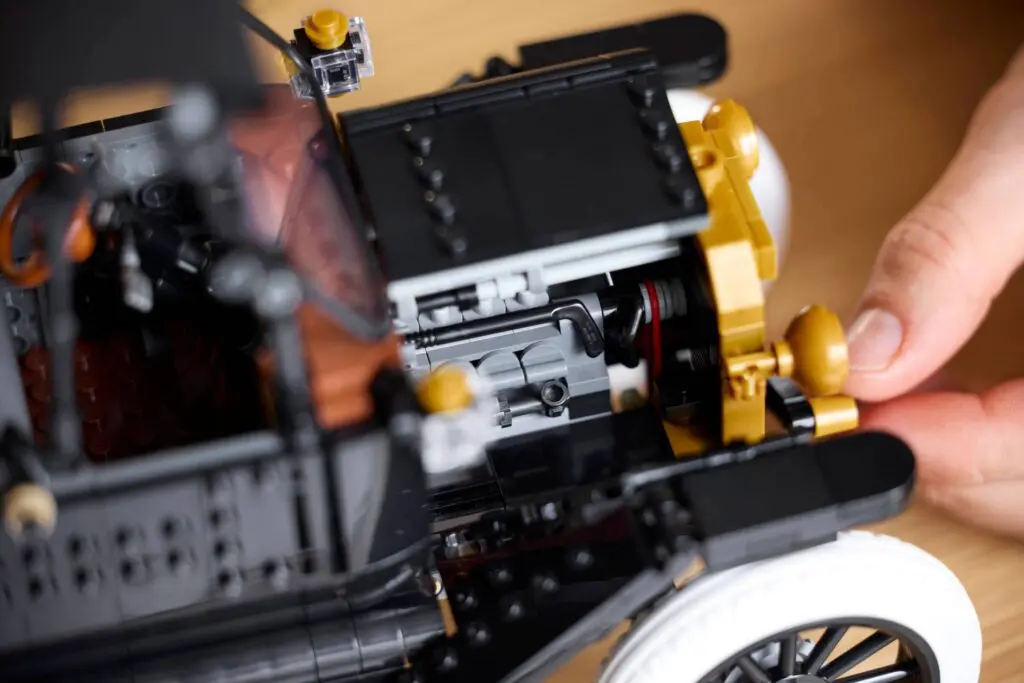 Hands building a toy car