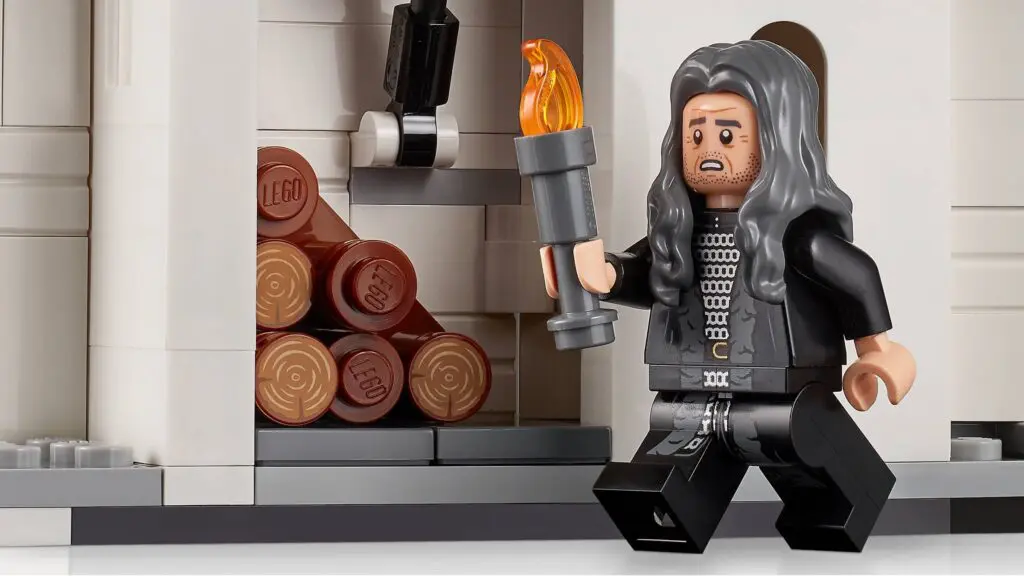 Toy character with long hair and torch