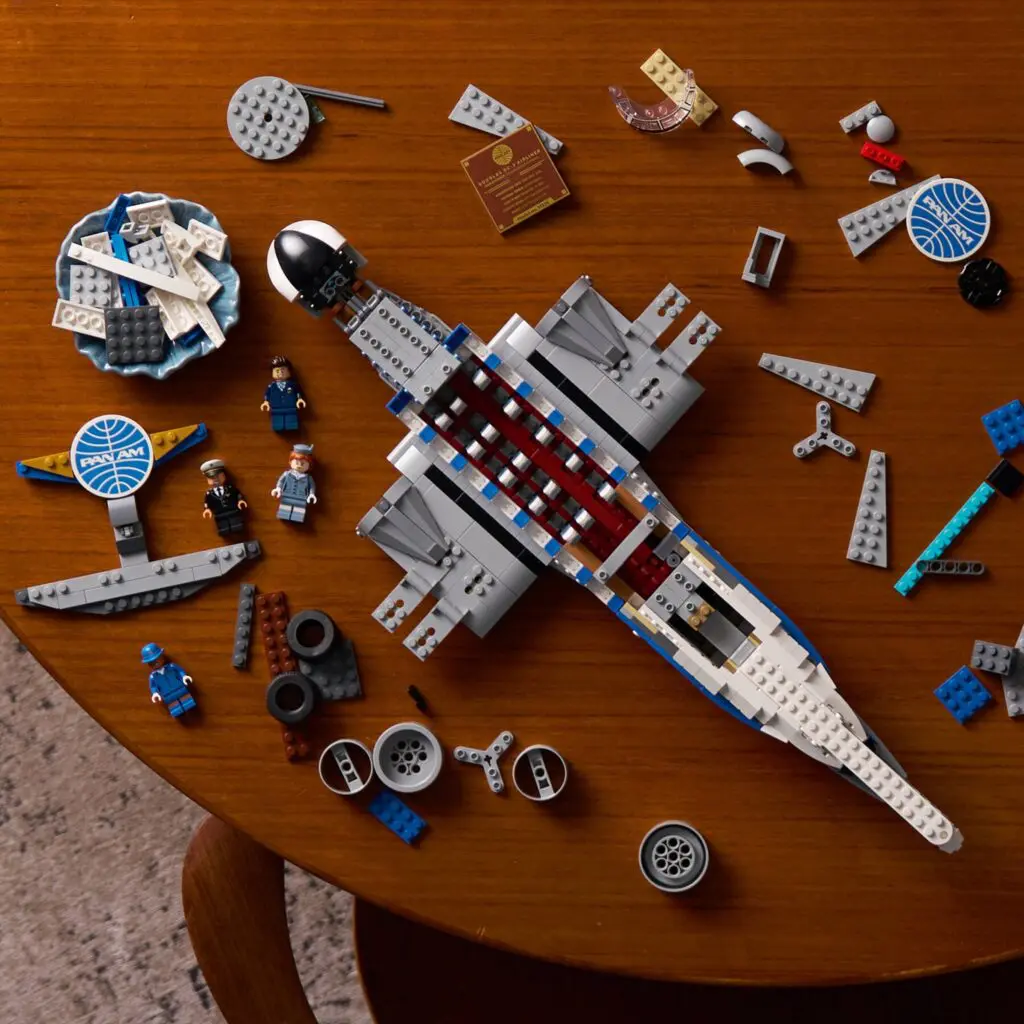 Partially built LEGO spaceship with scattered bricks