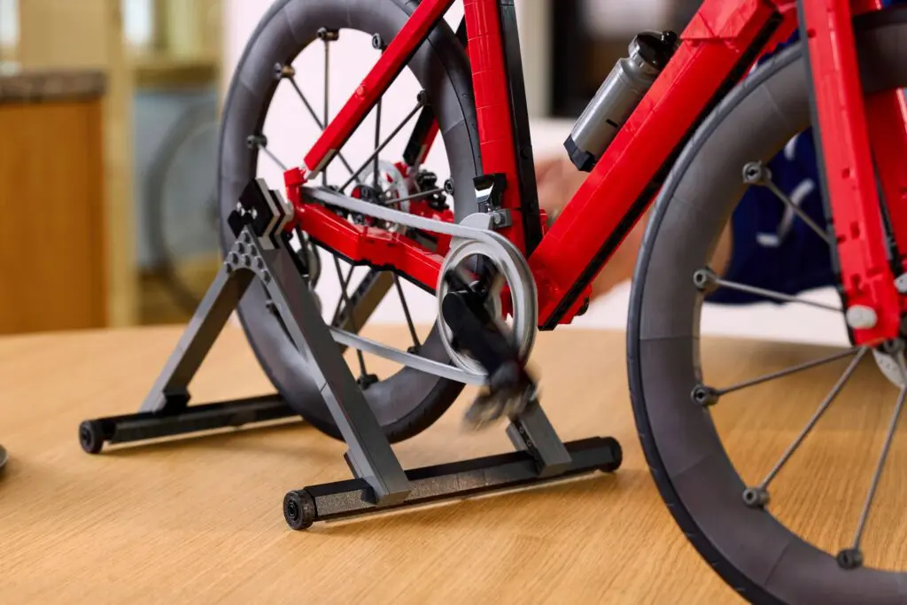 Bicycle on wooden floor with trainer