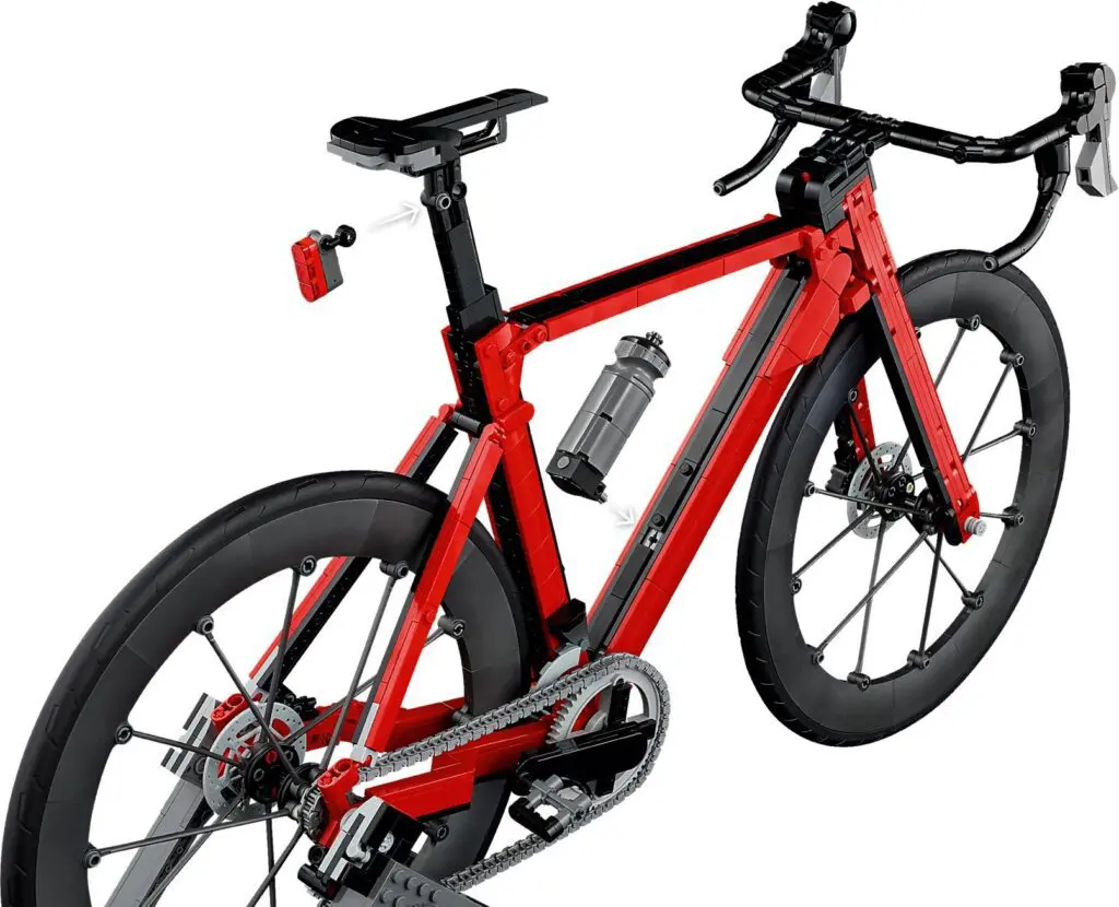 Red toy bicycle with black wheels