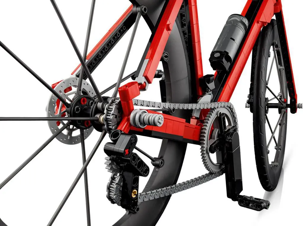 Red LEGO bicycle rear wheel and gear detail.