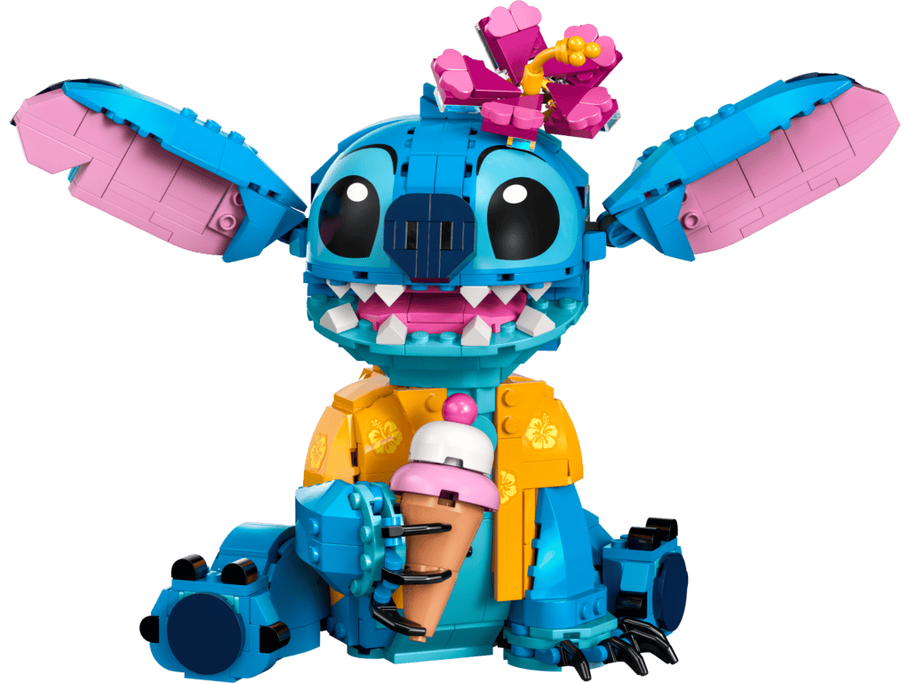 Cute alien toy wearing a flower accessory