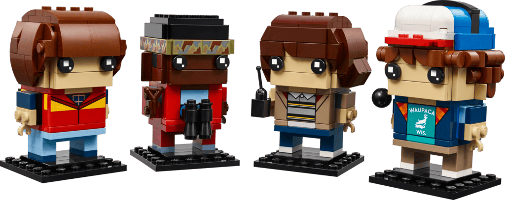Four toy figures in retro outfits