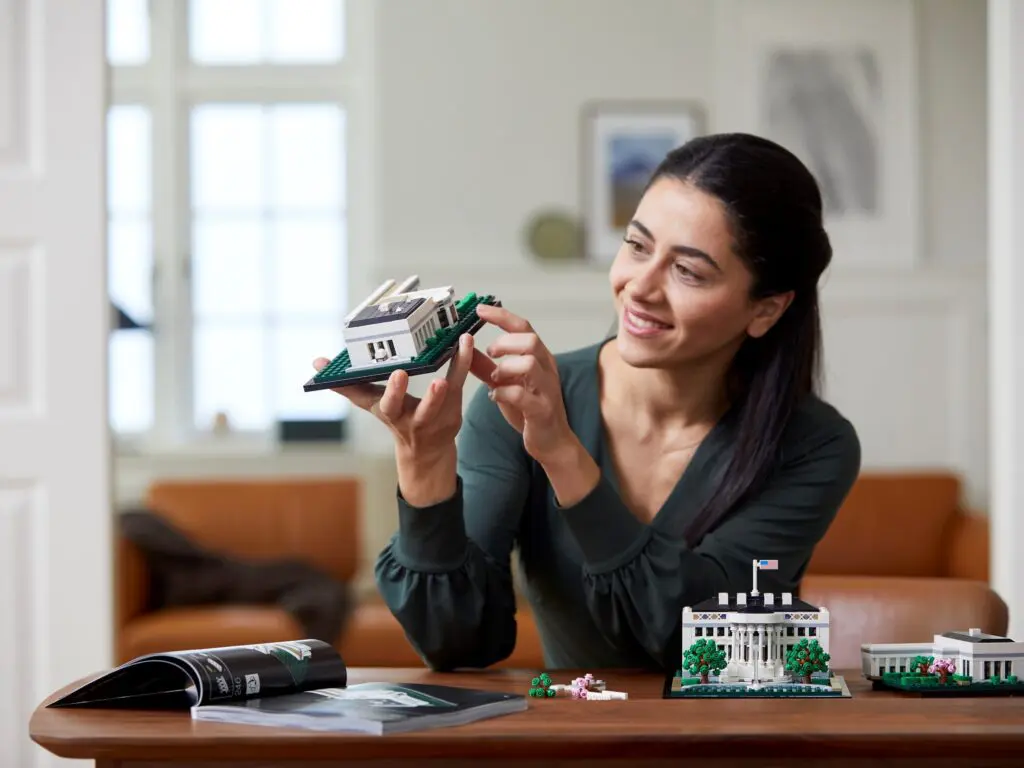 Woman assembling architectural model kit