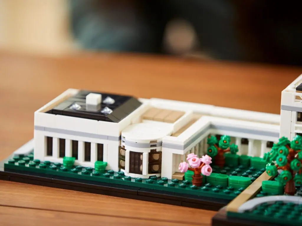Miniature white house model on table