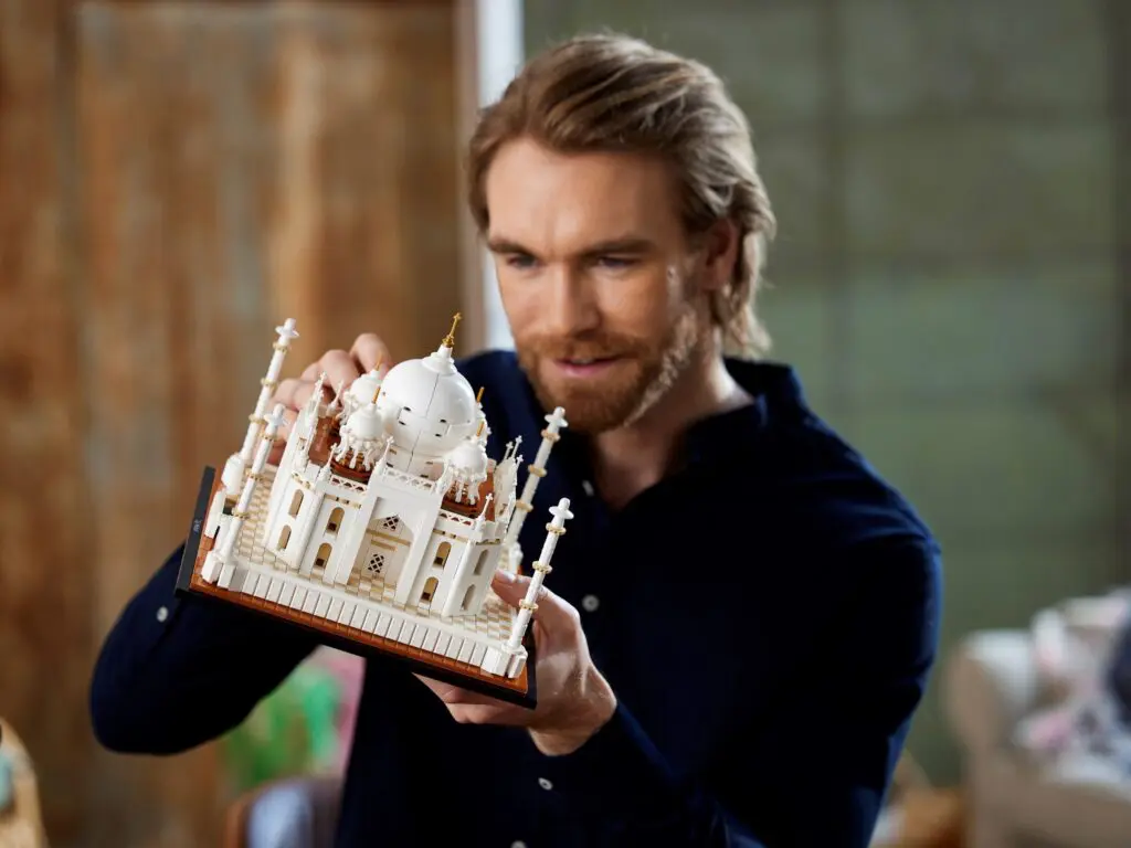 Man holding a miniature Taj Mahal model