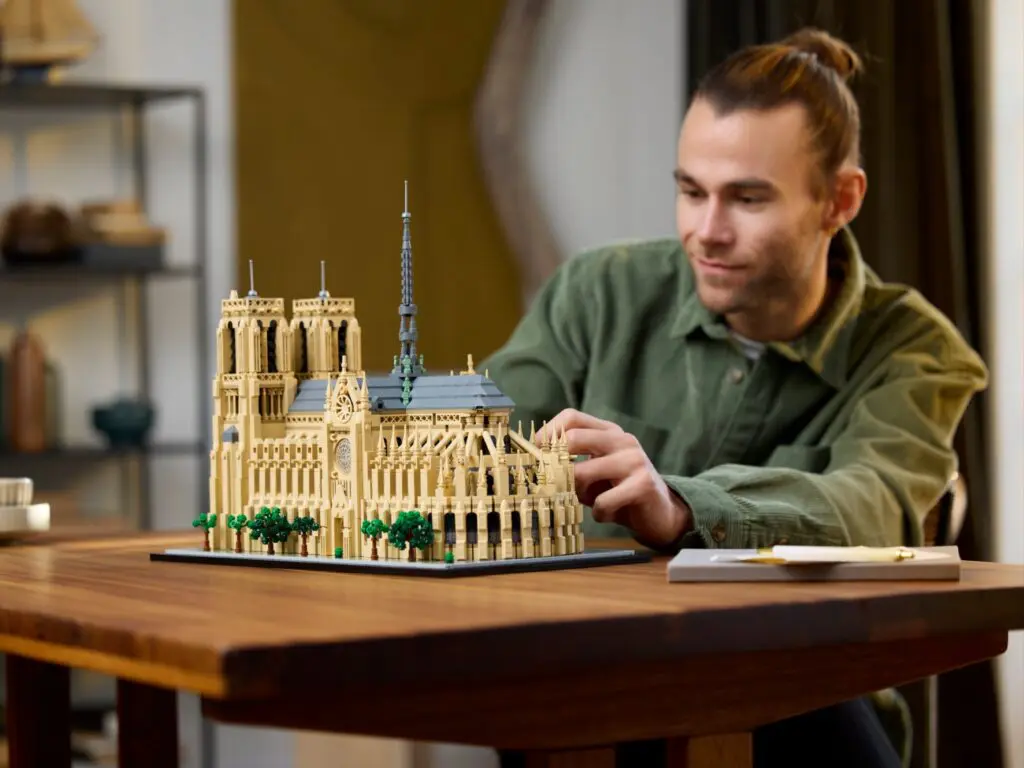 Person building detailed cathedral replica