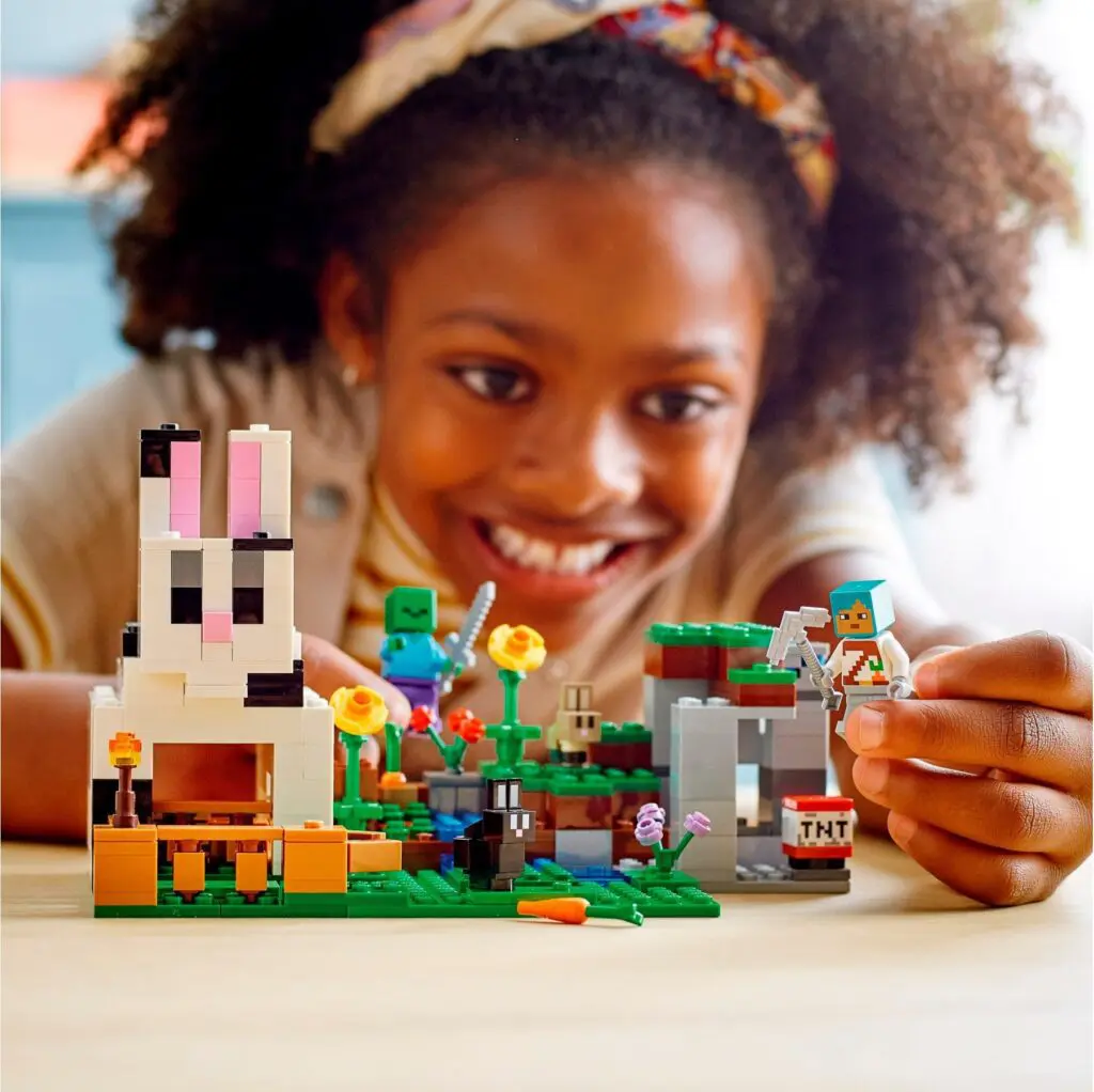 Child playing with Minecraft-themed Lego set
