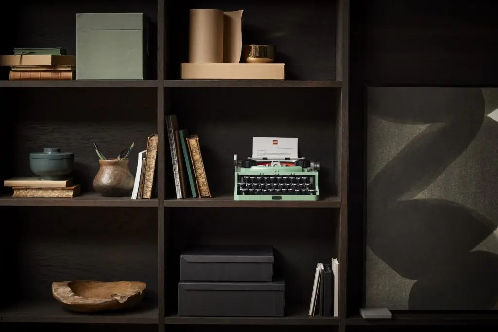 Shelves with books and typewriter