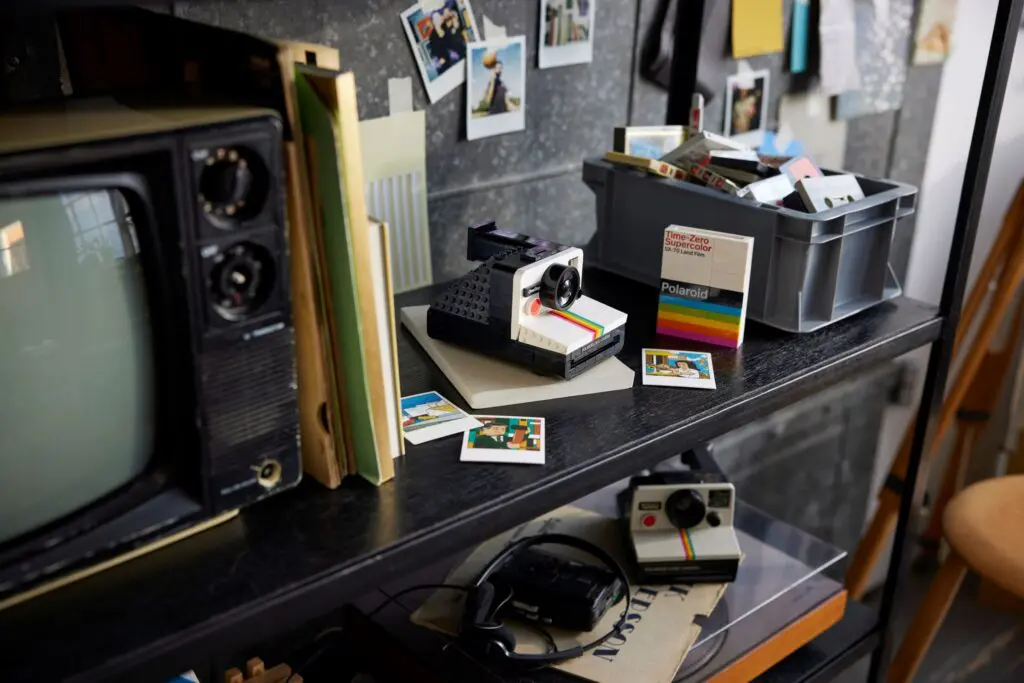 Vintage camera and photos on shelf