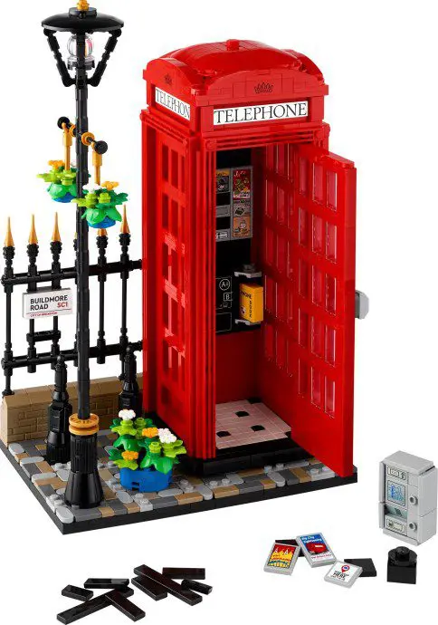 Red toy telephone booth with accessories