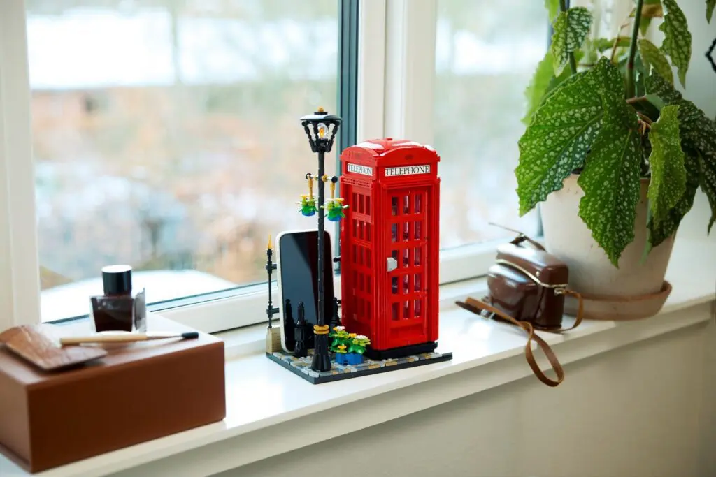 Toy phone booth on window sill