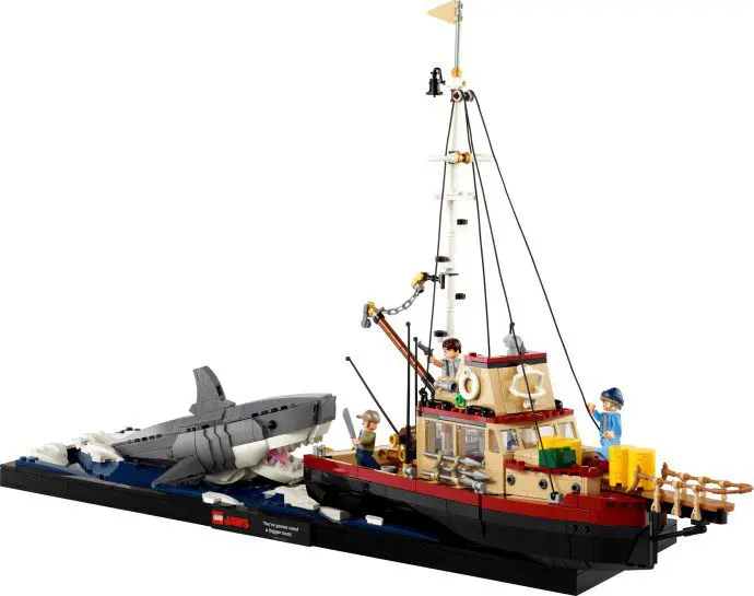 Toy boat and shark scene with figures