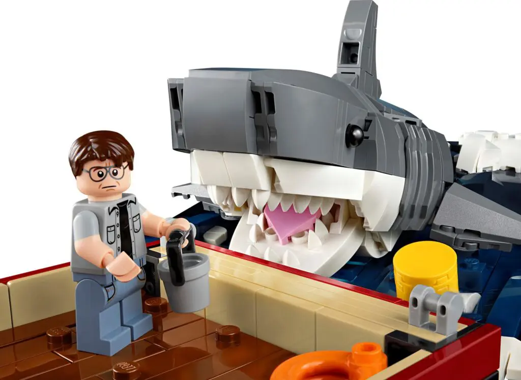 LEGO figure with shark in background