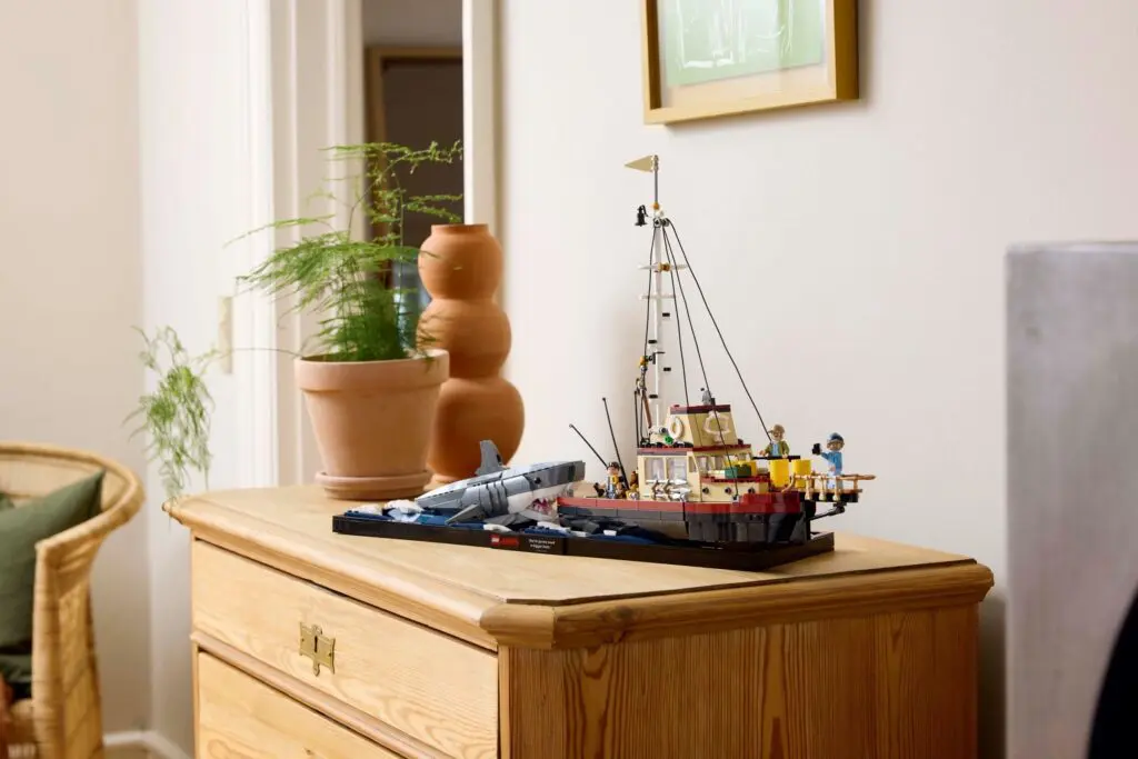 Wooden dresser with model ship display