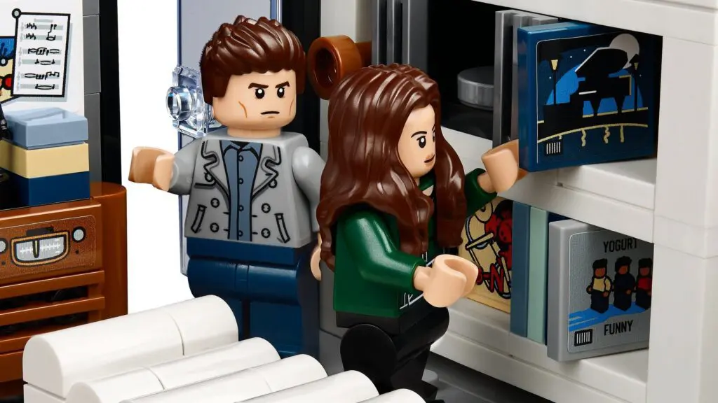 Mini figures exploring a record collection
