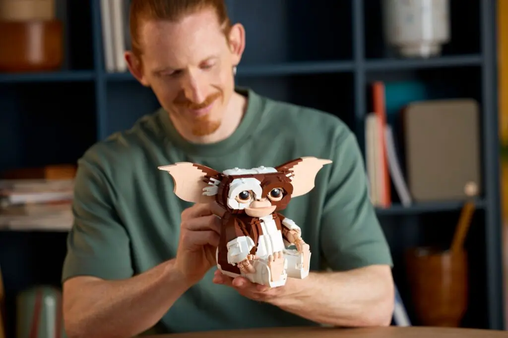 Man holding a Gremlins toy