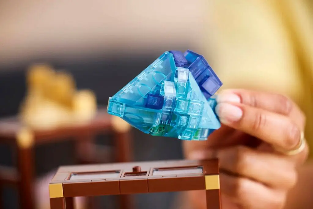 Hand holding blue toy spaceship