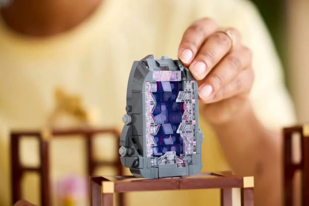 Hand assembling LEGO portal