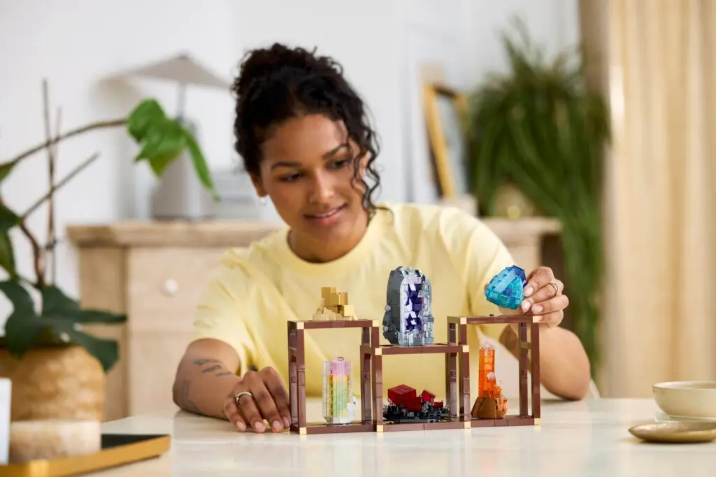 Individual placing gems in wooden cases