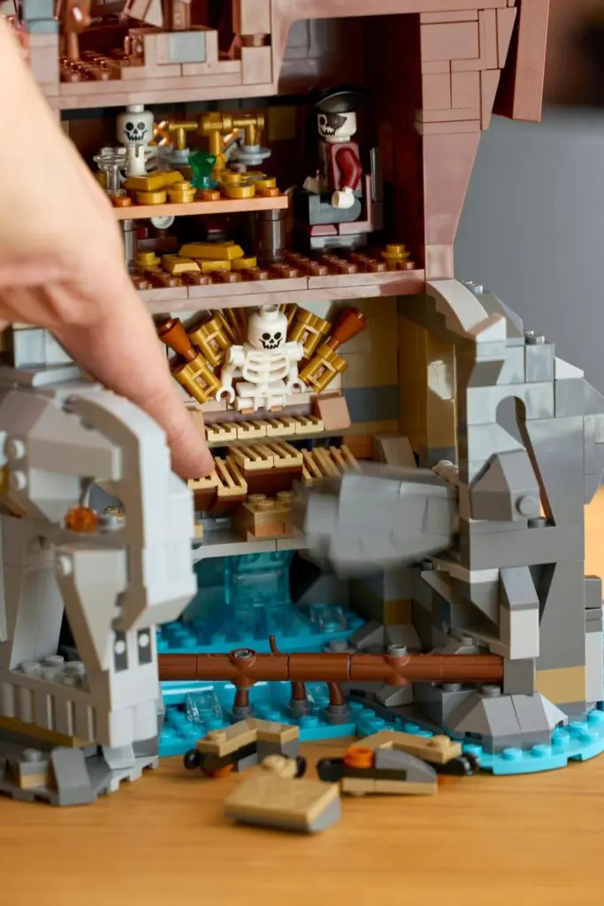 Hand interacting with Lego pirate set
