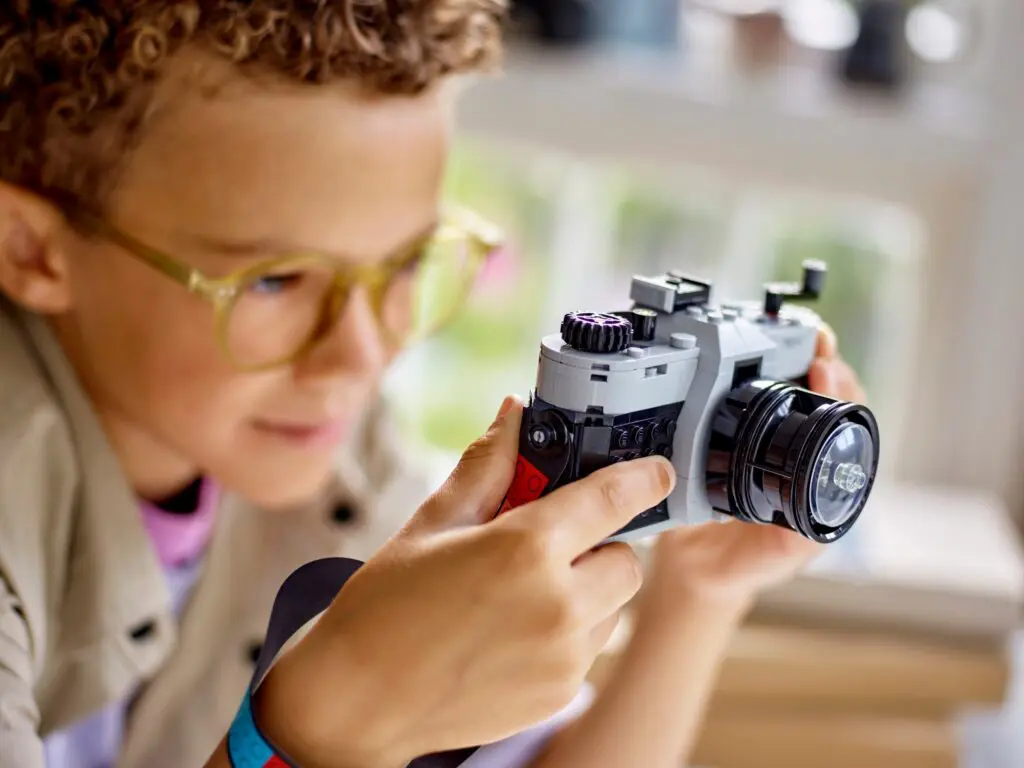 Young photographer with retro camera