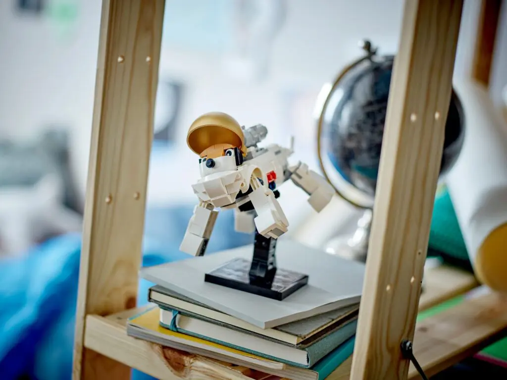 Space-themed LEGO model on books