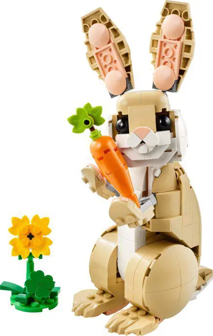 Toy rabbit holding orange carrot