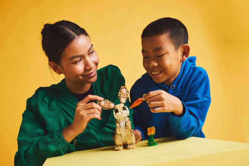 Siblings playing with construction set